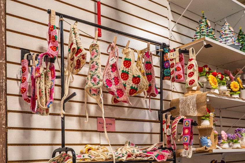 Hats, scarves, and accessories at a vendor booth in Amish Country