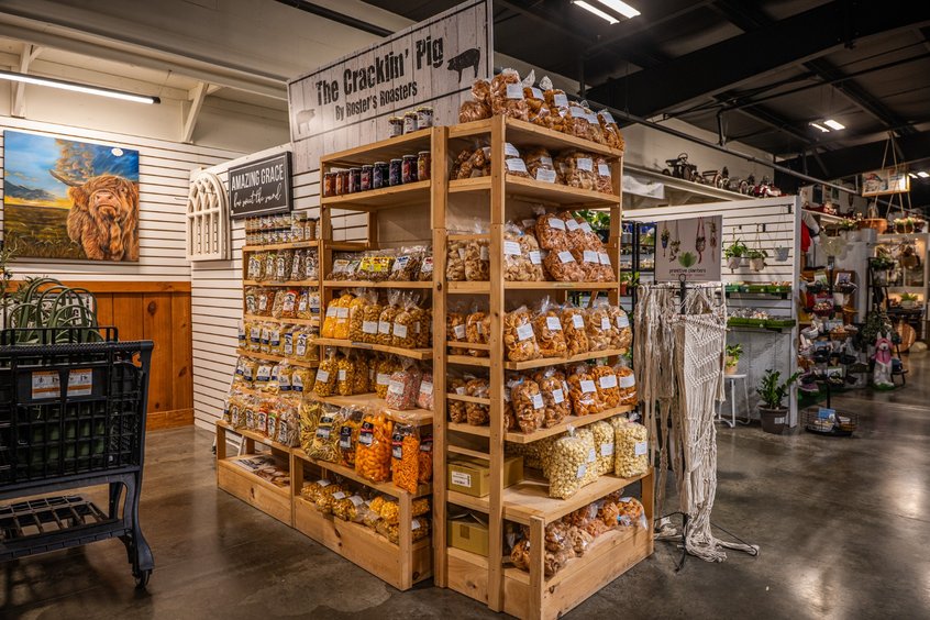 Snacks and candy on a vendor shelf at Ohio's Market Berlin