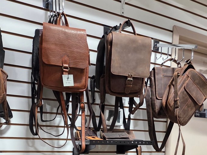Leather wallets and belts on a vendor table at Ohio's Market Berlin in Holmes County